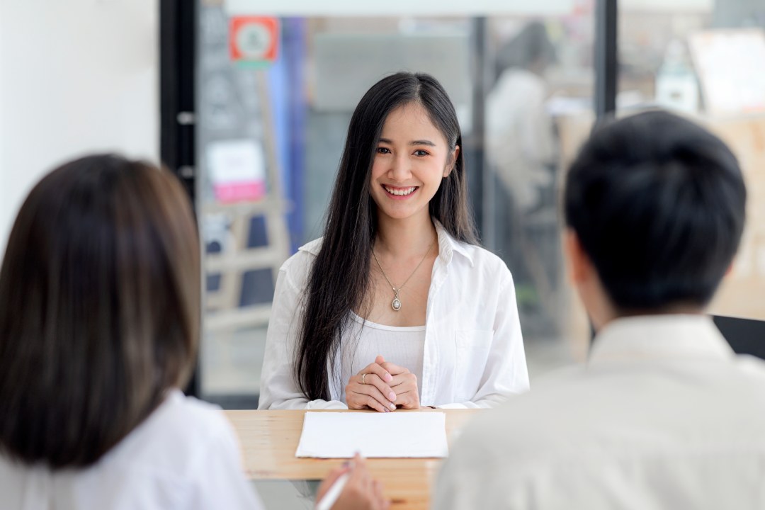 Young beautiful asian woman interviewing