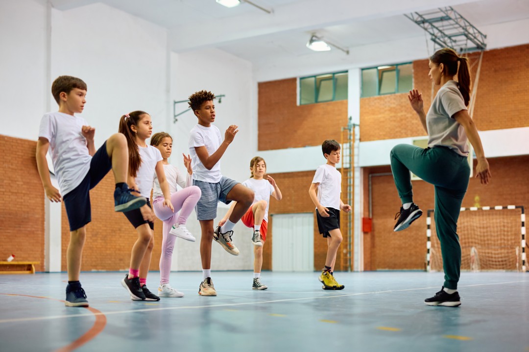 Group of elementary students having PE class.