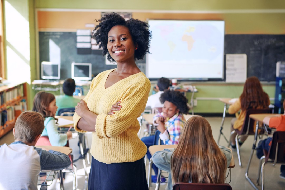 Teacher with arms crossed