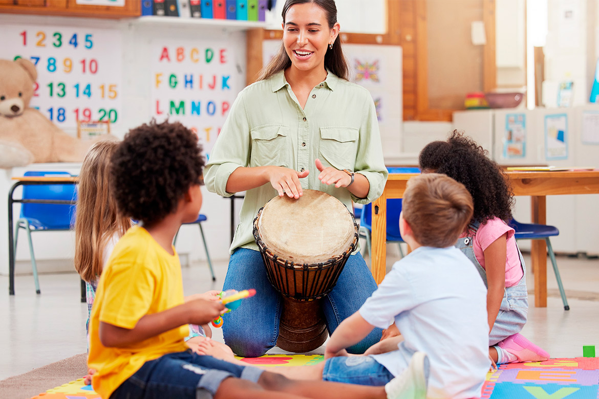 teacher with drum at kid class