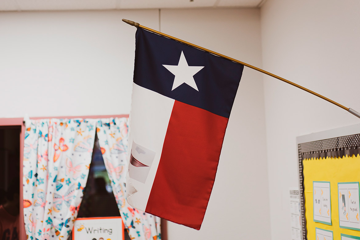Texas flag displayed in a classroom, symbolizing the theme of becoming a biology teacher in Texas.