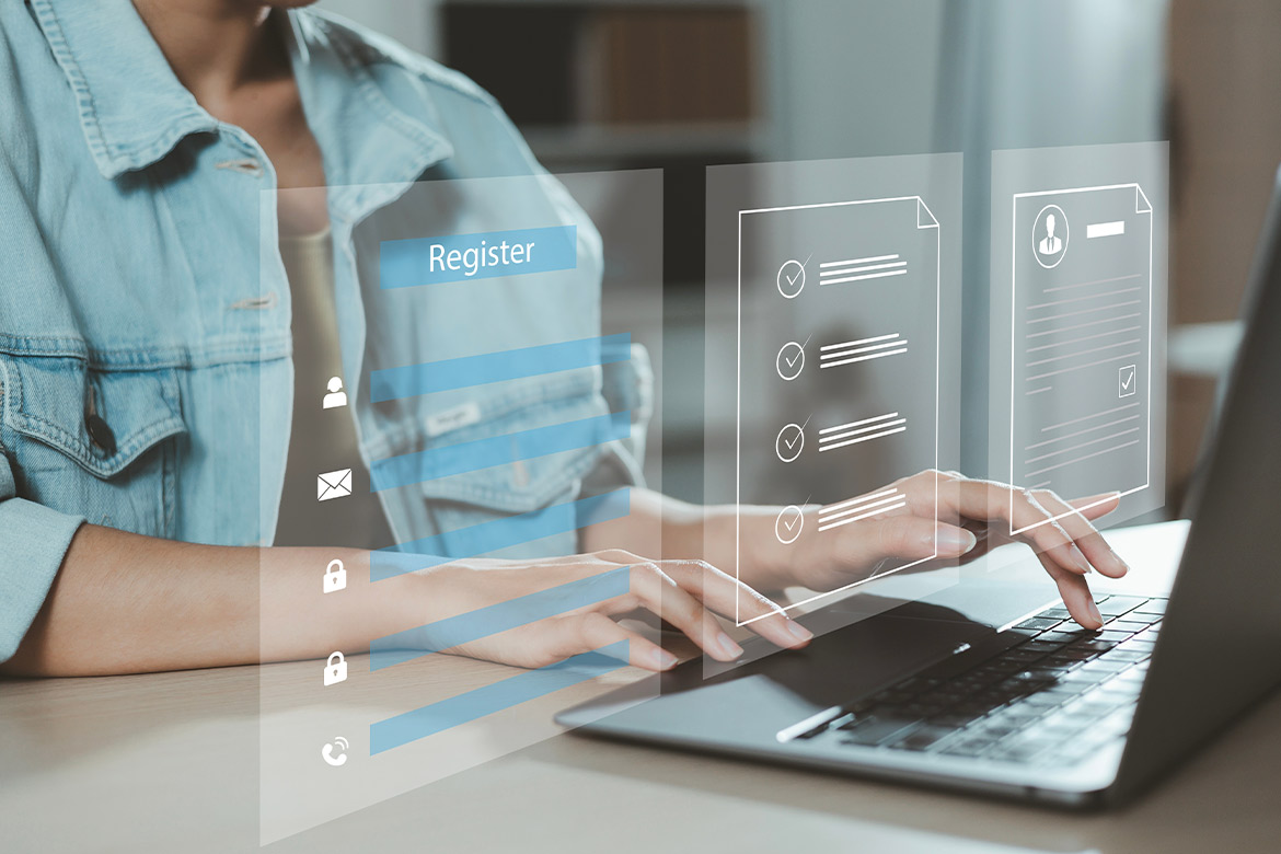 A woman using a laptop, exploring a digital interface about teaching certification transfer from Georgia to Texas.